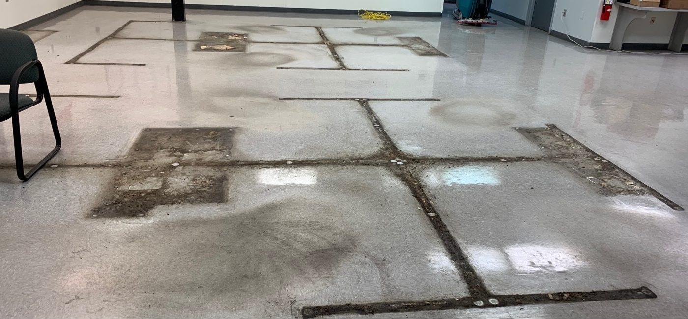 Commercial floor before professional floor care in Charlotte