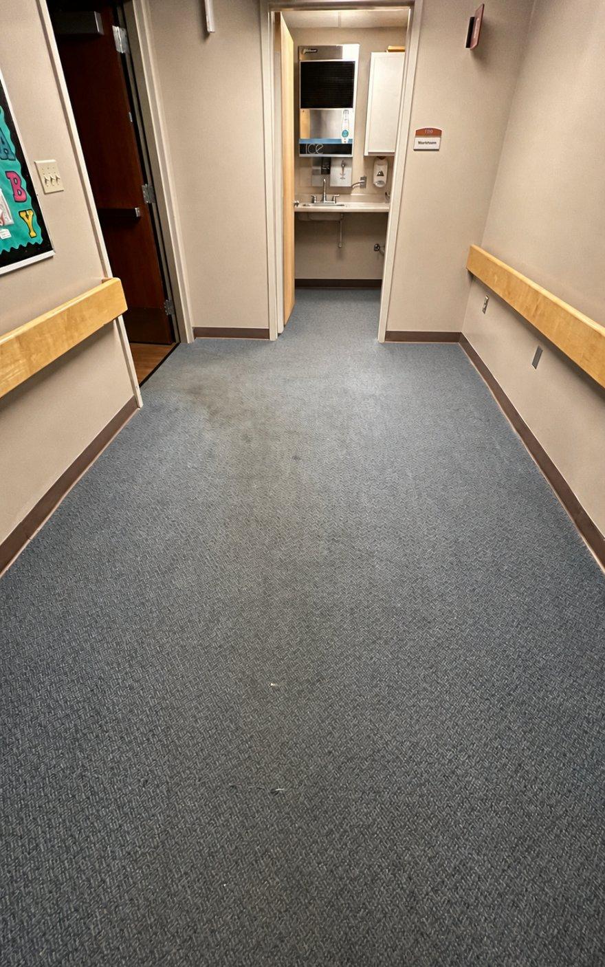Hospital corridor carpet before Dust Away hot water extraction